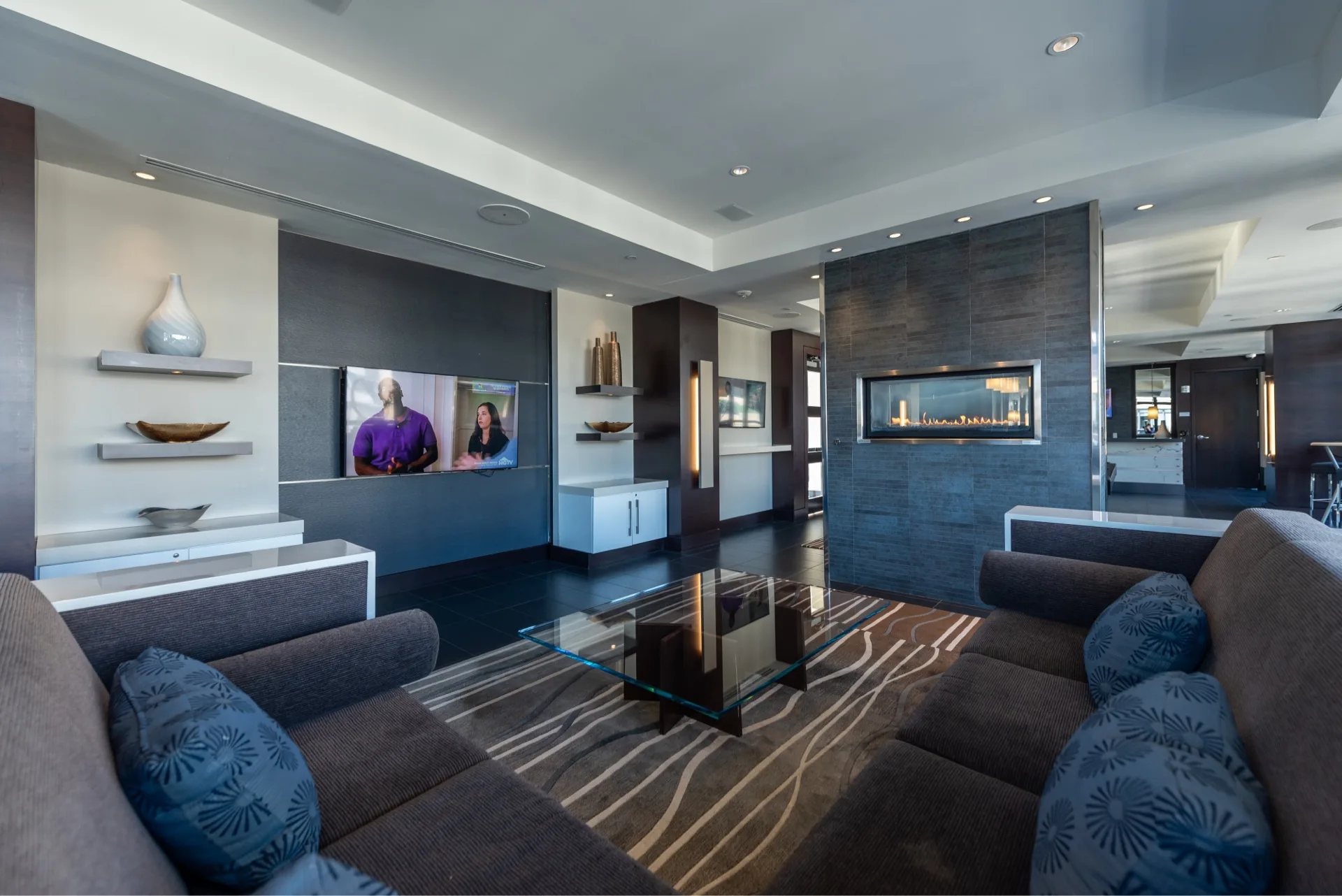 Rooftop lounge with coffee table and television