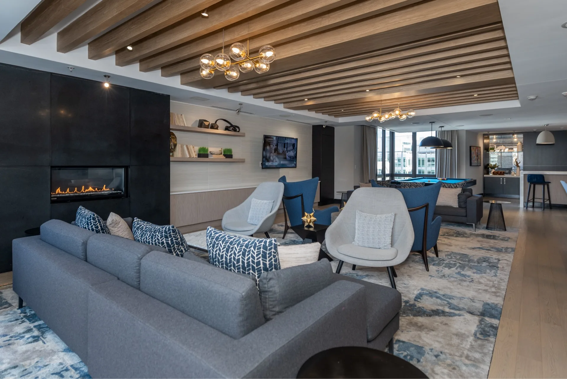 Lounge with couches chairs and a fireplace